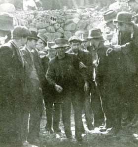 A rescued miner emerges.